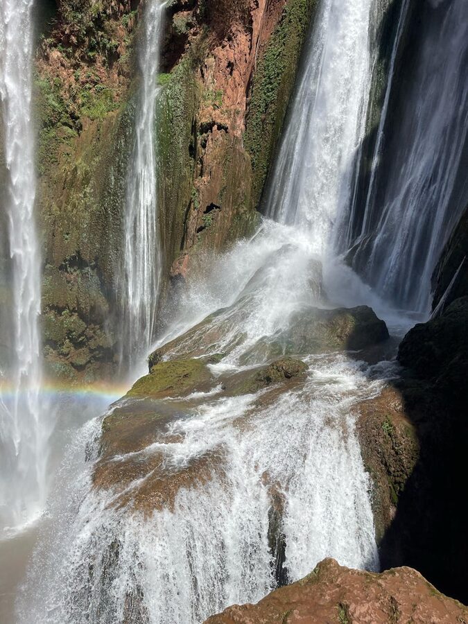 Waterfall with rainbow at Morocco mountain