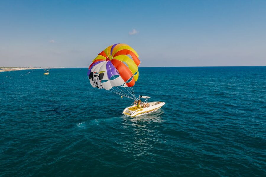 Parasailing over crystal clear ocean waters
