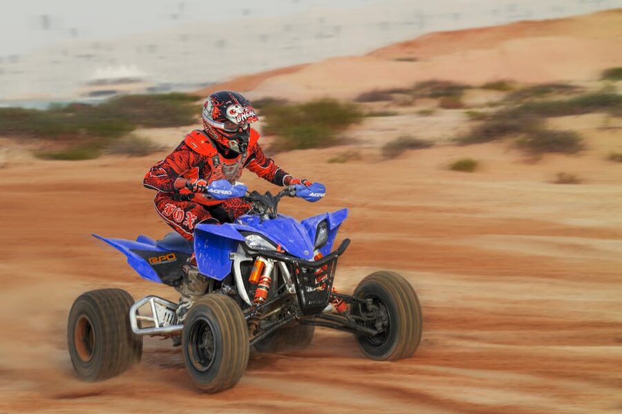 Quad bike rider in challenging terrain