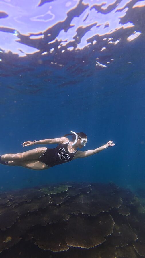 Snorkeler above coral reef