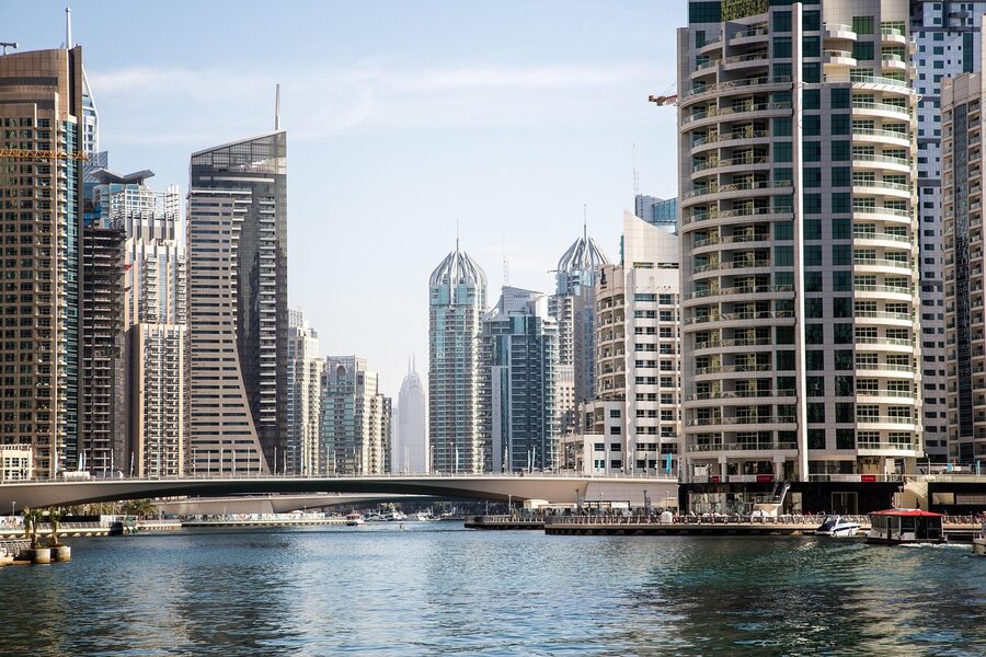 Speedboat in Dubai Marina with modern buildings in background