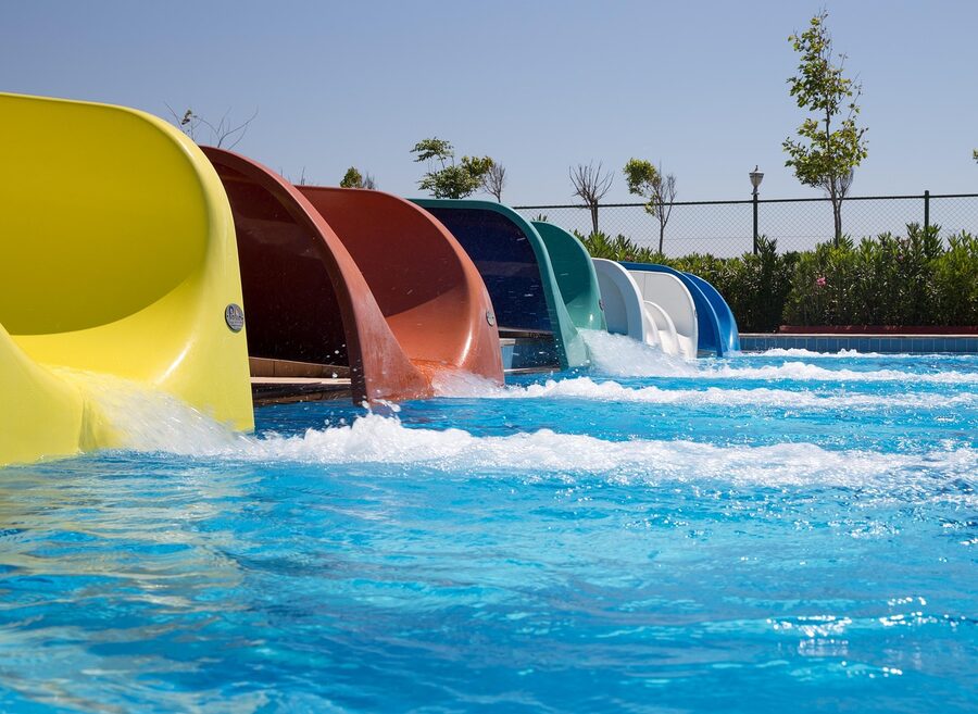 Water park slides with colorful tubes and splash pools