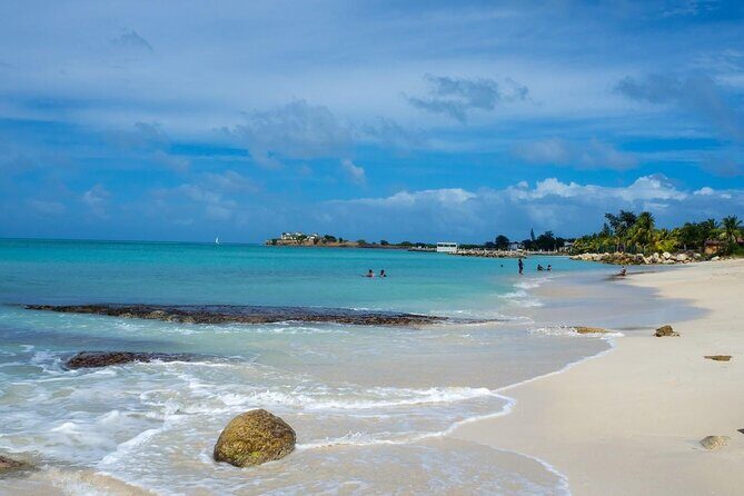 Famous Red Phone Booth Beach (Dickenson Bay) and Fort Bay Beach - The Sum Up